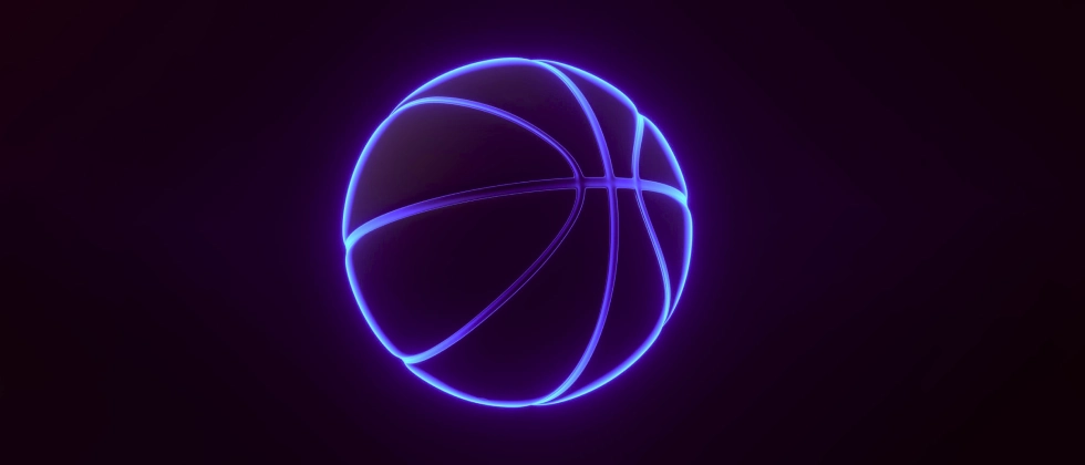 basketball glowing in purple neon color on black background