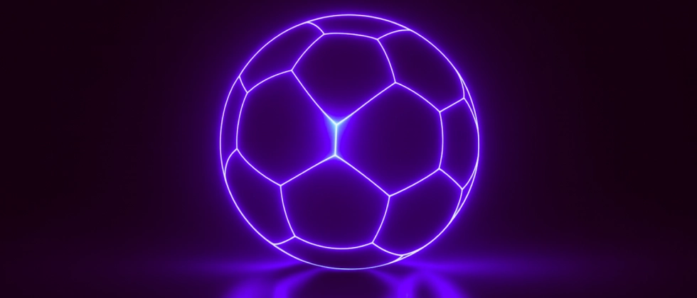 football ball glowing in purple neon light on dark background